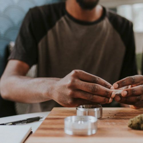 Person rolling joint